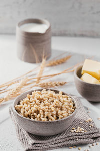 Bowl of cooked peeled barley grains porridge