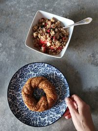 High angle view of hand holding bowl of food