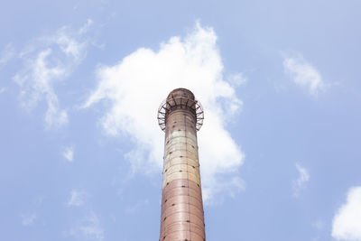 Low angle view of smoke stack against sky