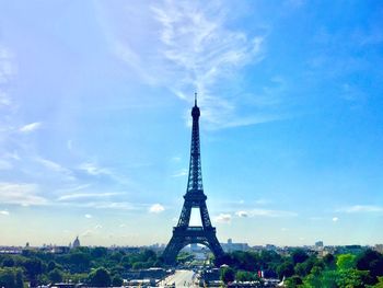 Tower against cloudy sky