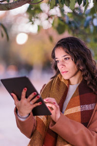 Young woman using mobile phone