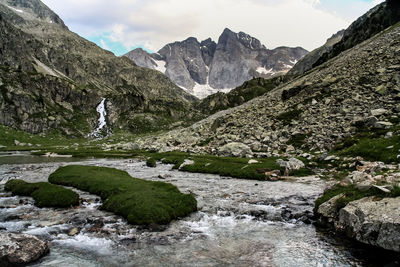 Stream by rocks at pyrenees