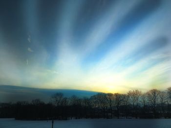 Scenic view of lake against sky during winter