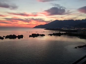 Scenic view of sea against cloudy sky