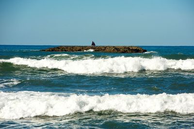 Scenic view of sea against clear sky