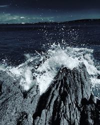 Close-up of sea waves at night