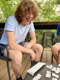 Young man laughing while playing a game