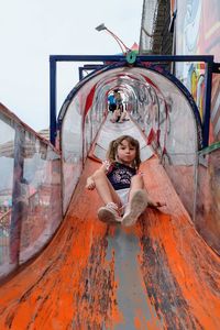 Girl playing at slide