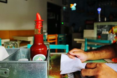 Close-up of man working in tray