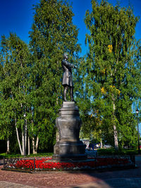 Statue in park against clear sky