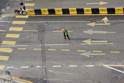 High angle view of person crossing on street