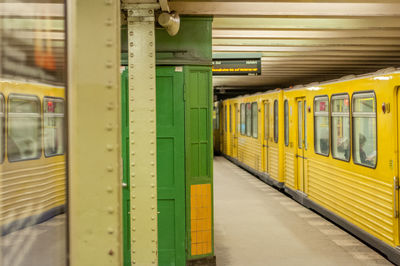 Yellow metro train at subway station