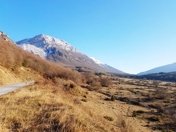 Scenic view of landscape against clear blue sky