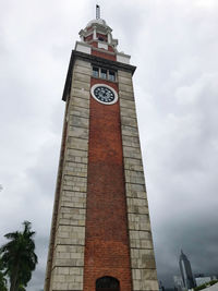 Low angle view of clock tower against sky