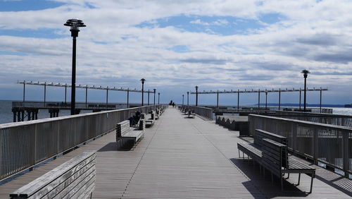 View of pier on sea against sky