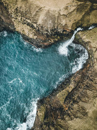 High angle view of rock formation in sea