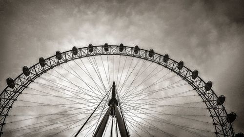 Low angle view of ferris wheel against sky