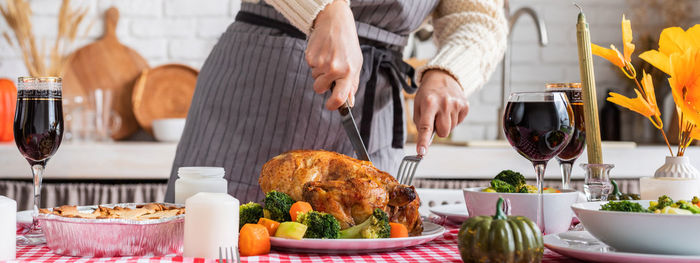 Happy thanksgiving day. autumn feast. woman celebrating holiday cooking traditional dinne