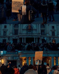 People on street against buildings in city