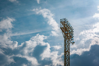 A stadium floodlight on the sky background