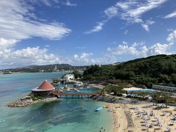 Scenic view of swimming pool by sea against sky