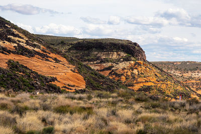 Rock formations on landscape against sky