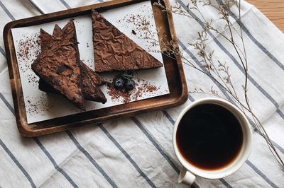 High angle view of chocolate cake and coffee on table