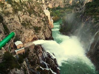 High angle view of waterfall along rocks