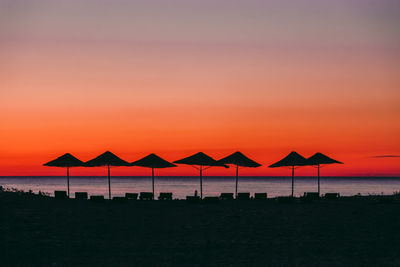 Scenic view of beach against sky during sunset