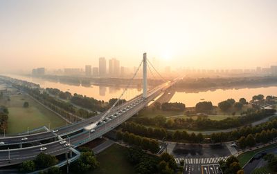 High angle view of city at sunset