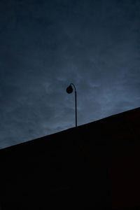 Low angle view of street light against sky at night