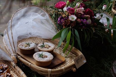 High angle view of fresh white flowers in basket on table