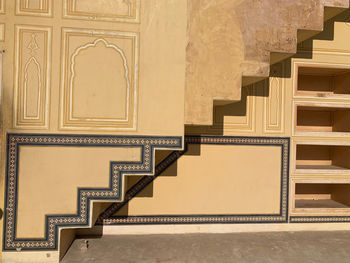 Staircase in the indian fort of nahargarh with reflection over the wall.