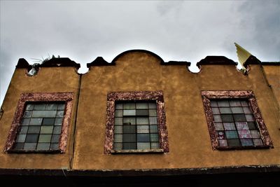 Low angle view of old building against sky