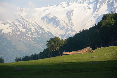Scenic view of snowcapped mountains against sky