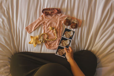 Midsection of woman using mobile phone