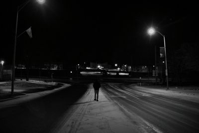 People walking on road at night