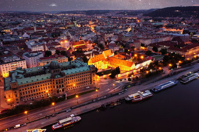 High angle view of illuminated buildings in city at night