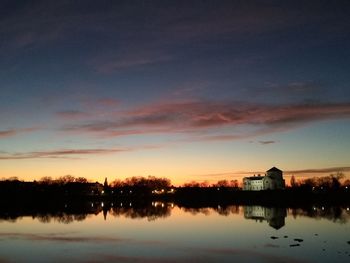 Scenic view of lake against sky during sunset