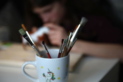 Close-up of coffee cup on table