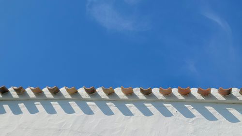 Low angle view of building against blue sky