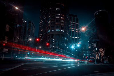 Illuminated long exposure city street at night