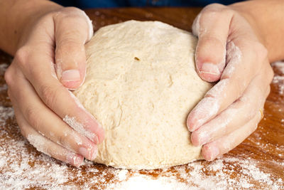 Close-up of person preparing food on table