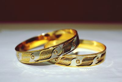 Close-up of wedding rings on table