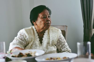 Senior woman sitting at table