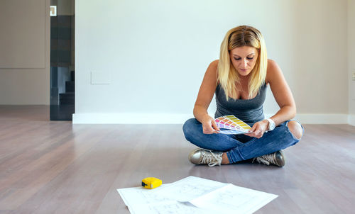 Young woman sitting at home