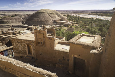 High angle view of old buildings against sky