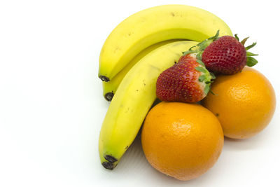 Close-up of fruits against white background