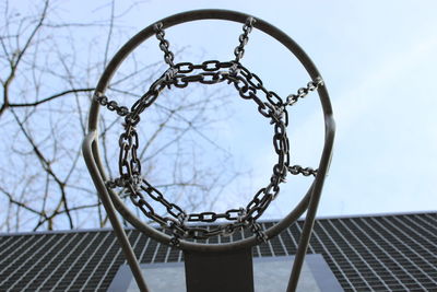 Low angle view of basketball hoop against sky