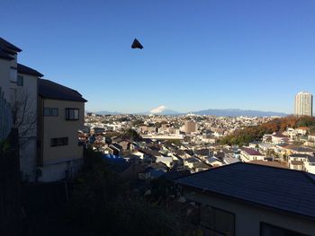 Residential buildings against blue sky